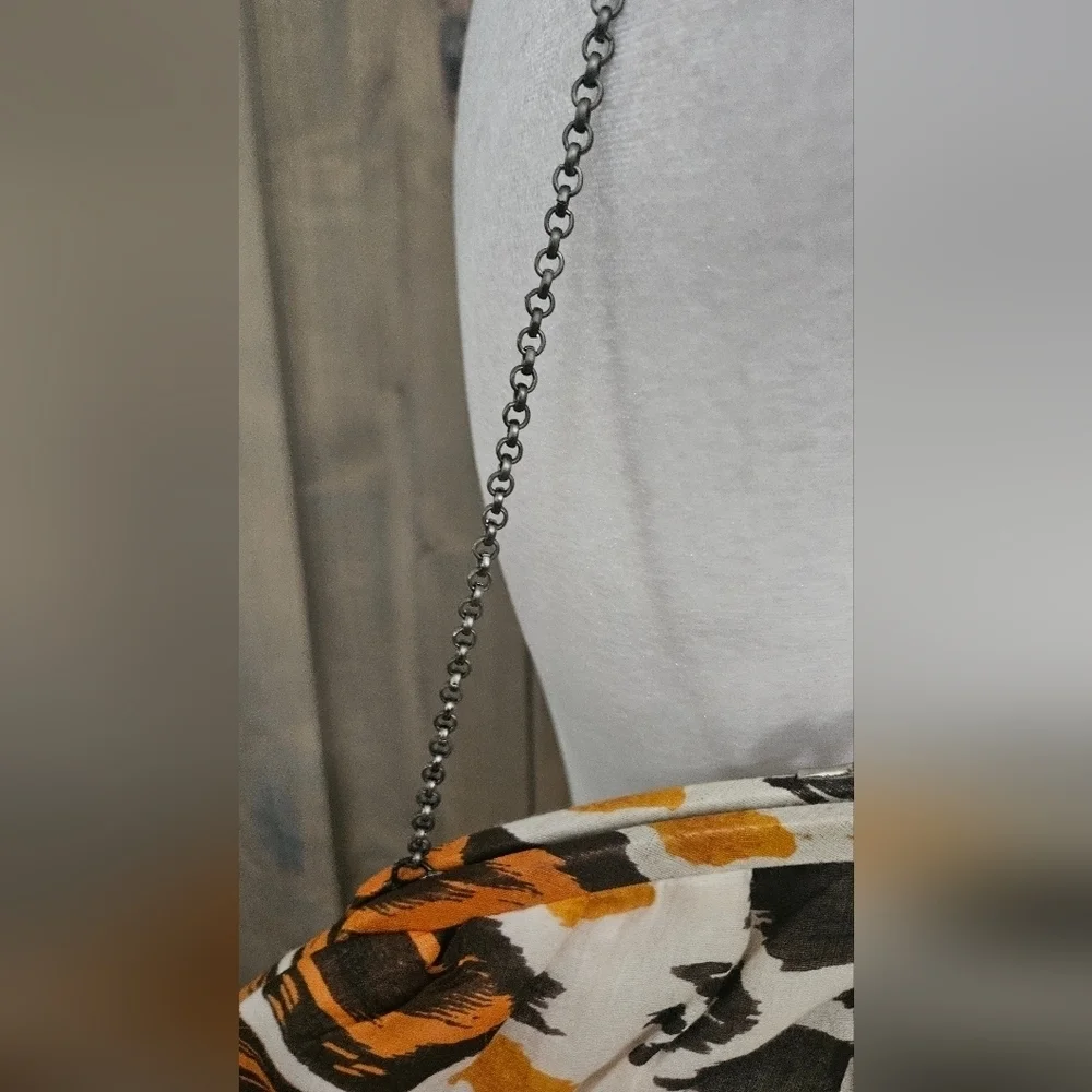 K.C.MALHAN Ikat Printed Woven Cloth Dumpling Chain Bag In Orange/brown Multi.